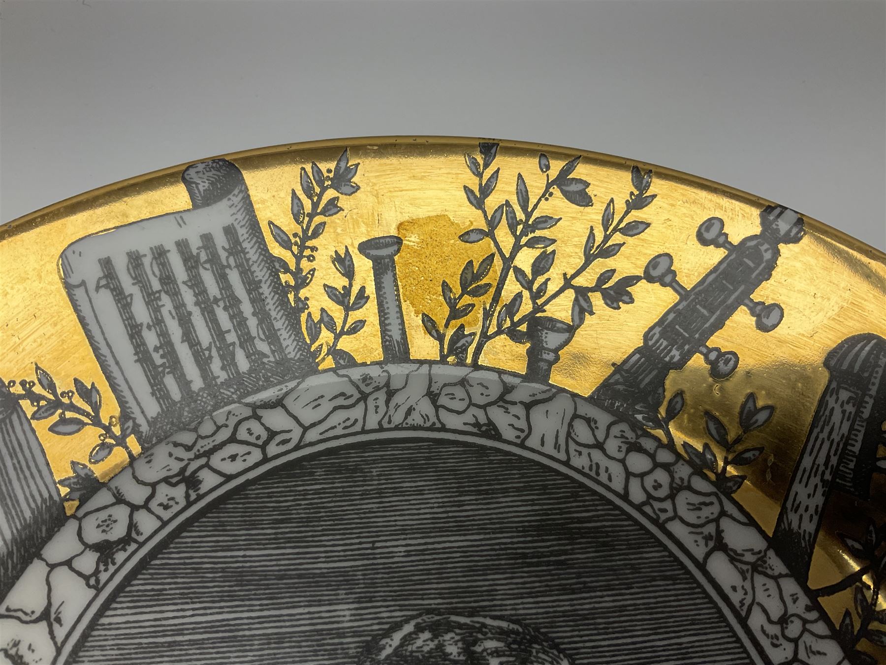 Fornasetti Grandi Maestri plate, depicting Giuseppe Verdi within a border of operatic emblems on gilt ground, with printed mark beneath, D25cm