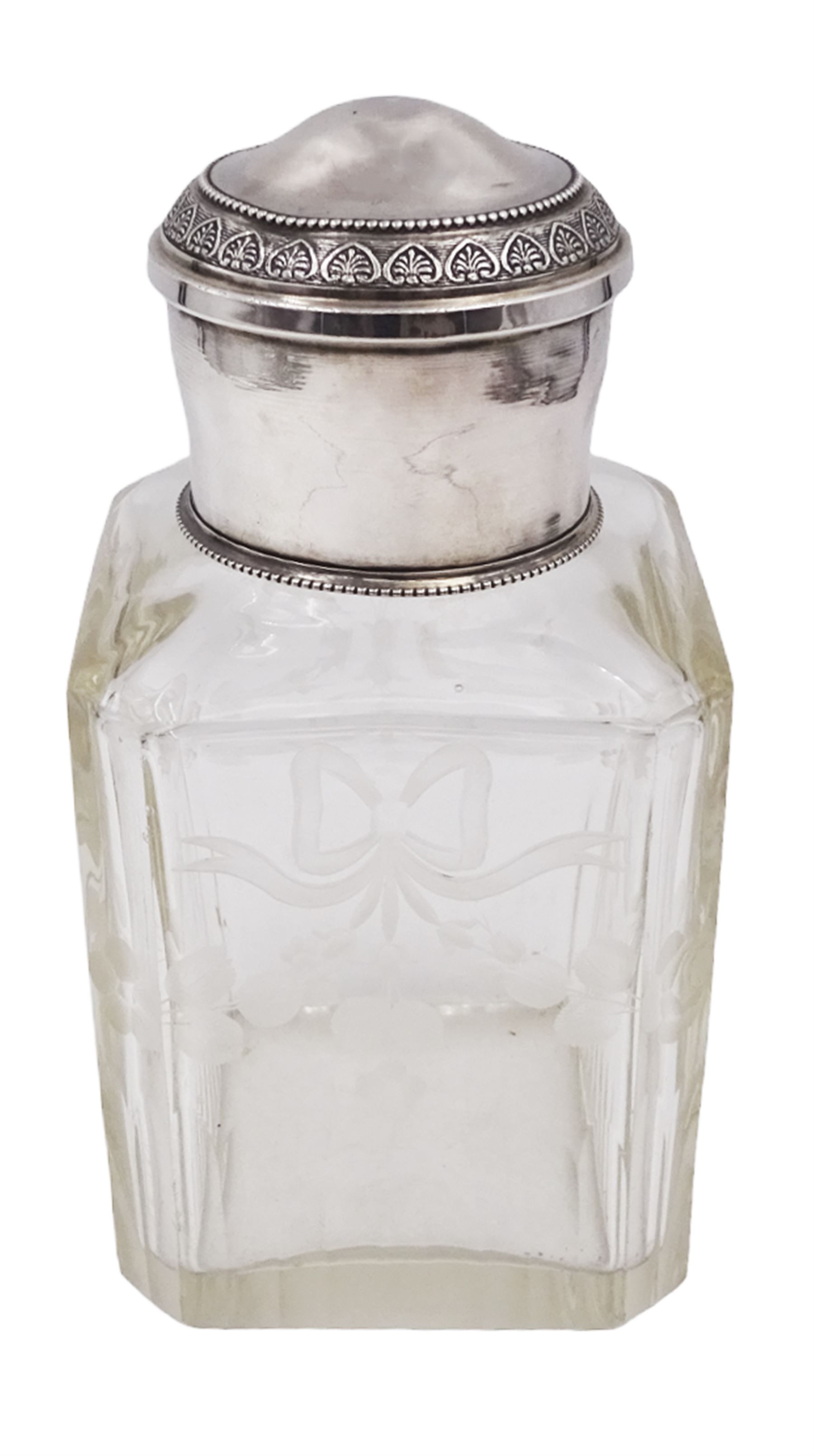 Early 20th century French silver mounted glass scent bottle, the faceted rectangular glass body etched with swags of flowers united by ribbons, with cylindrical silver cover embossed with foliate detail and beaded decoration with gilt interior, marked with Minerva's head, with white metal collar and glass stopper, H17cm
