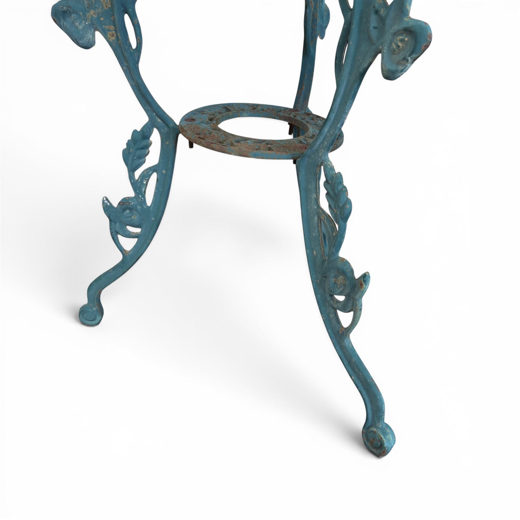 Cast iron garden table and four chairs, in the Art Nouveau style, with pierced floral and foliate decoration throughout, circular table raised on four cabriole legs with stretcher ring, chairs with shaped openwork backs and seats, in a weathered green finish