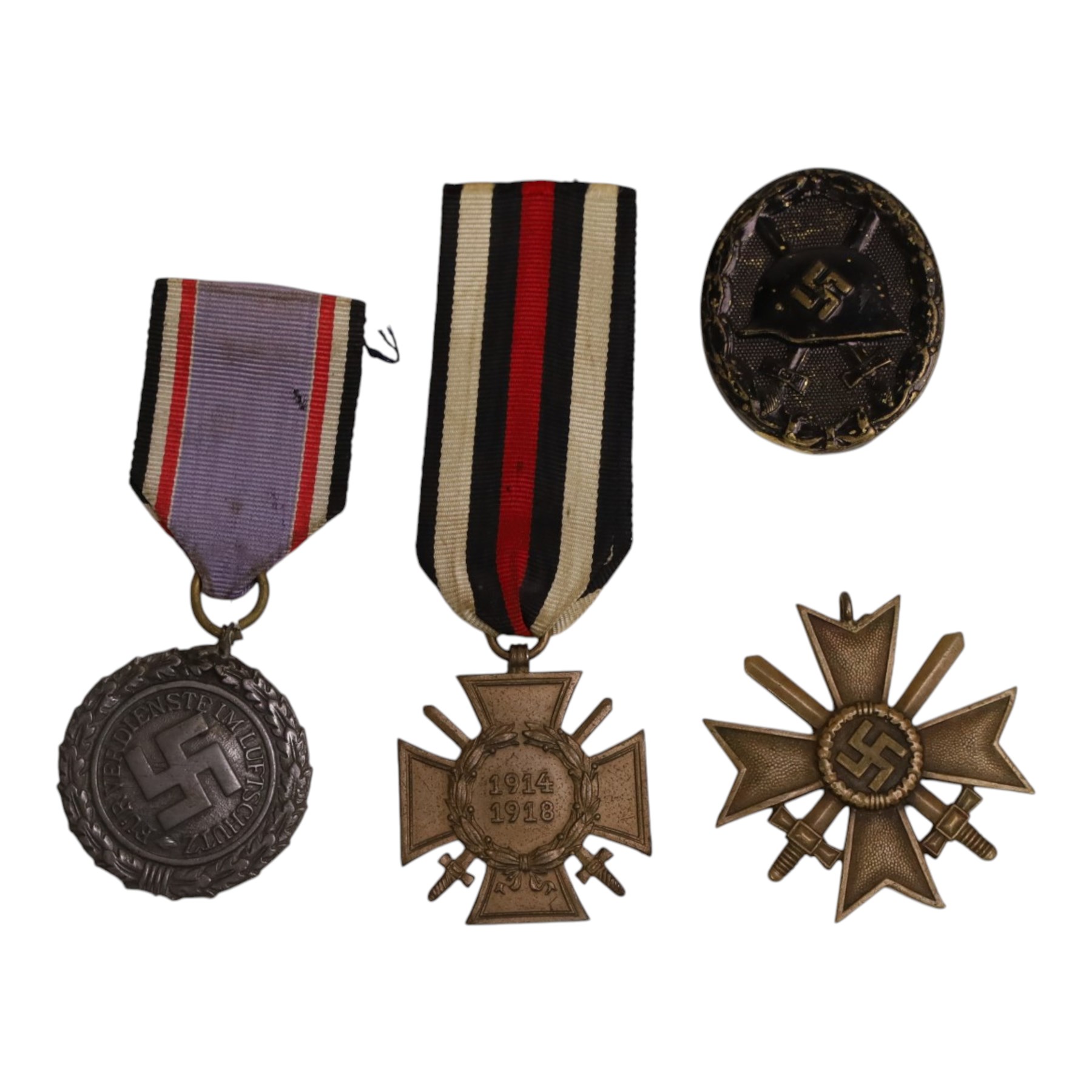 WWI German Hindenburg cross, together WWII bronze Merit Cross with crossed swords, Luftschutz Civil Defence medal and German Wound Badge 
