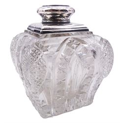 Early 20th century silver mounted cut glass decanter, of squat bulbous square form, the body with hobnail cut shoulders, facet cut edges, and hexagonal cut arched bands, with conforming square cut stopper, the silver neck hallmarked London, makers mark and date letter worn, date letter possibly 1922, makers mark indistinct, H17.5cm