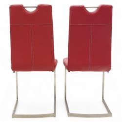 Set of seven contemporary style dining chairs, each with a high padded back and seat upholstered in faux leather on brushed steel sled bases  