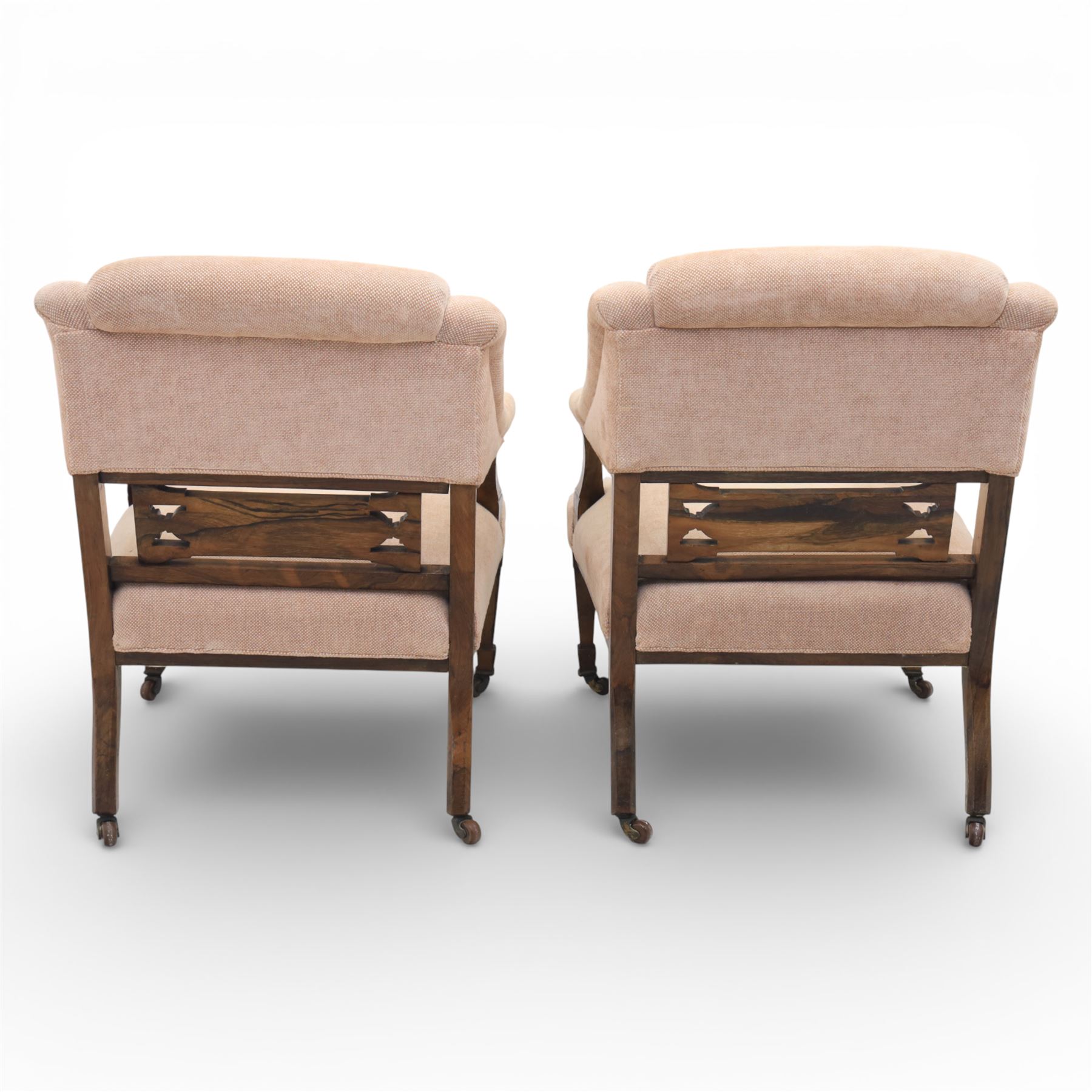 Quality Edwardian seven piece inlaid salon suite, comprising three seater settee, pair of arm chairs and four chairs with pierced splat backs, upholstered in pale pink fabric, inlaid with flowering urns, upon tapering legs with spade feet and castors