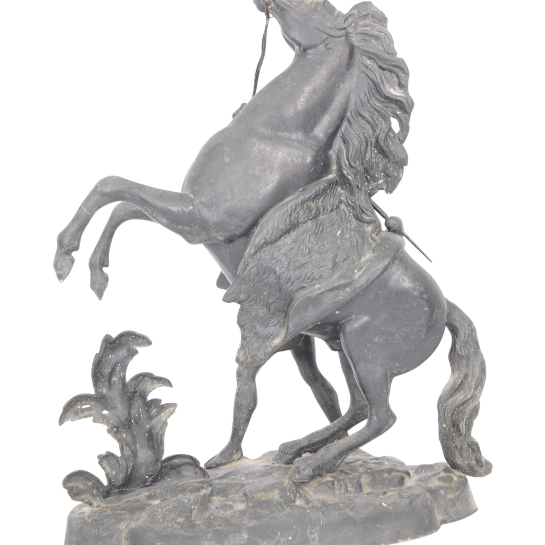 Three spelter Marley Horse figures, after Guillaume Coustou, each modelled as a rearing horse restrained by  groom, tallest H41cm