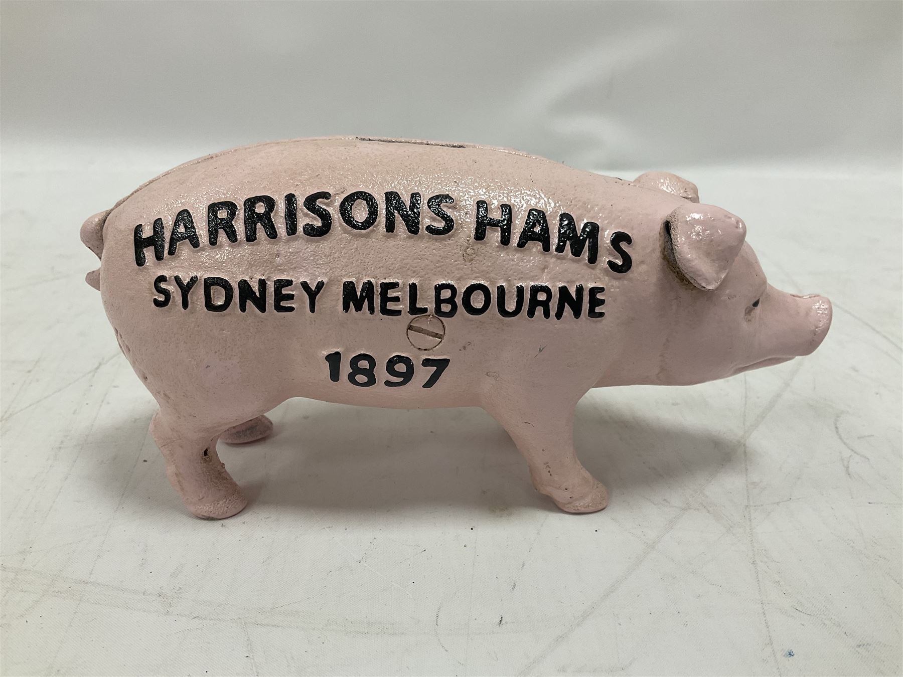 Cast iron Harrisons Hams money box, H10cm