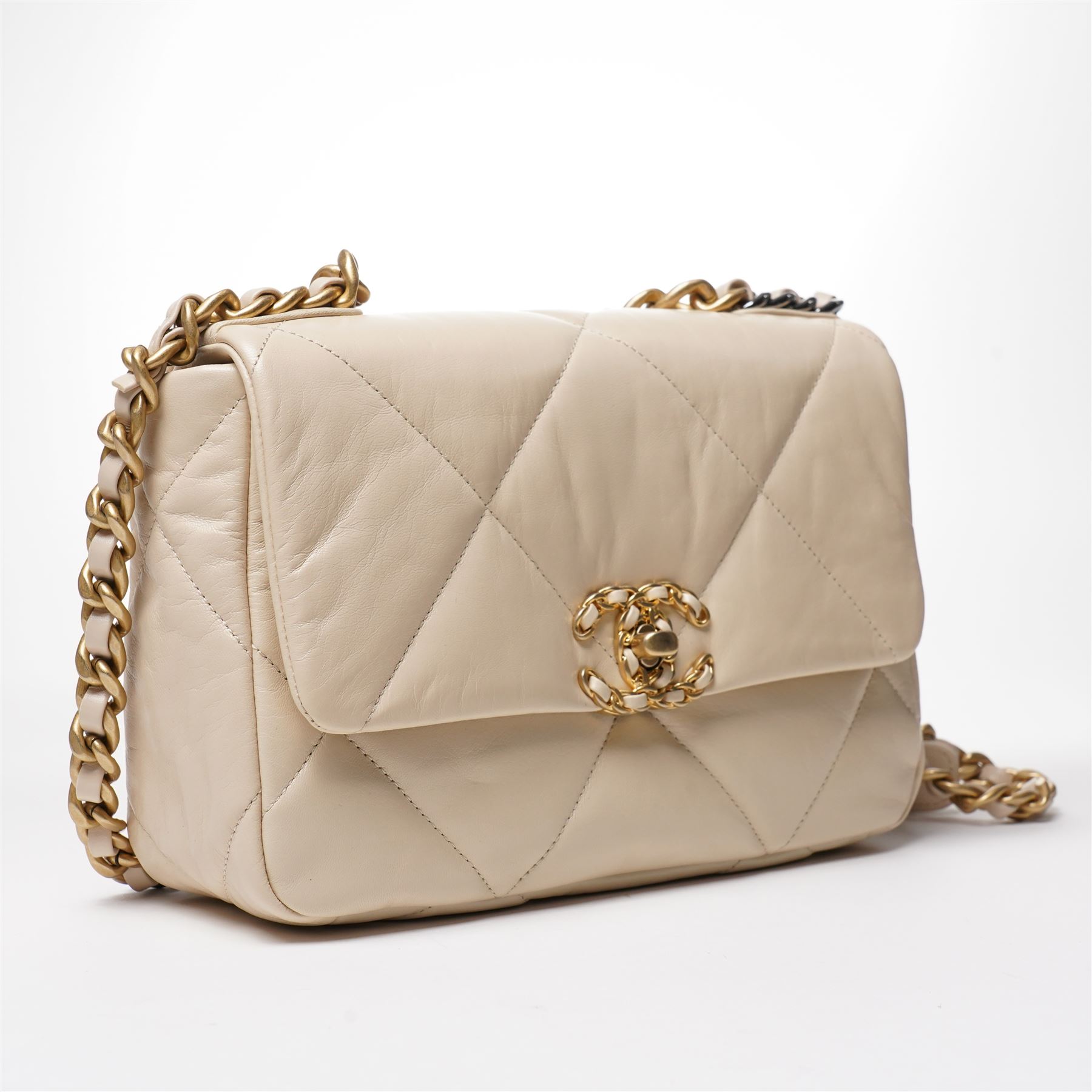 Chanel - ‘19’ Medium Flap Bag, the model introduced in 2019 as one of the final designs associated with Karl Lagerfeld, in cream quilted lambskin leather with mixed gold, silver and ruthenium-tone chain strap and signature CC monogram turn-lock fastening, unused with original dust bag and box