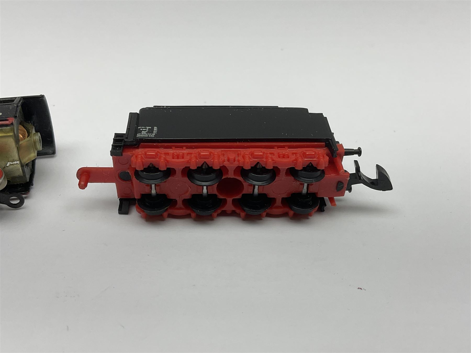 Marklin mini-club 'Z' gauge - DB Diesel Co-Co type locomotive; DB 0-6-0 Rangierlok type shuttle locomotive probably no.8864; and another DB 0-6-0 locomotive probably no.8800; together with an unmarked DB 4-6-2 tender locomotive and DB 2-6-0 tender locomotive; all unboxed (5)