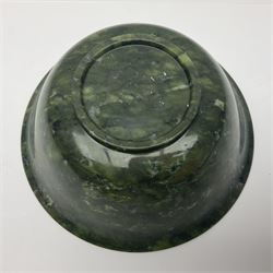 Chinese carved spinach jade bowl, with deep rounded sides rising to a flaring rim from a short circular foot, D21cm