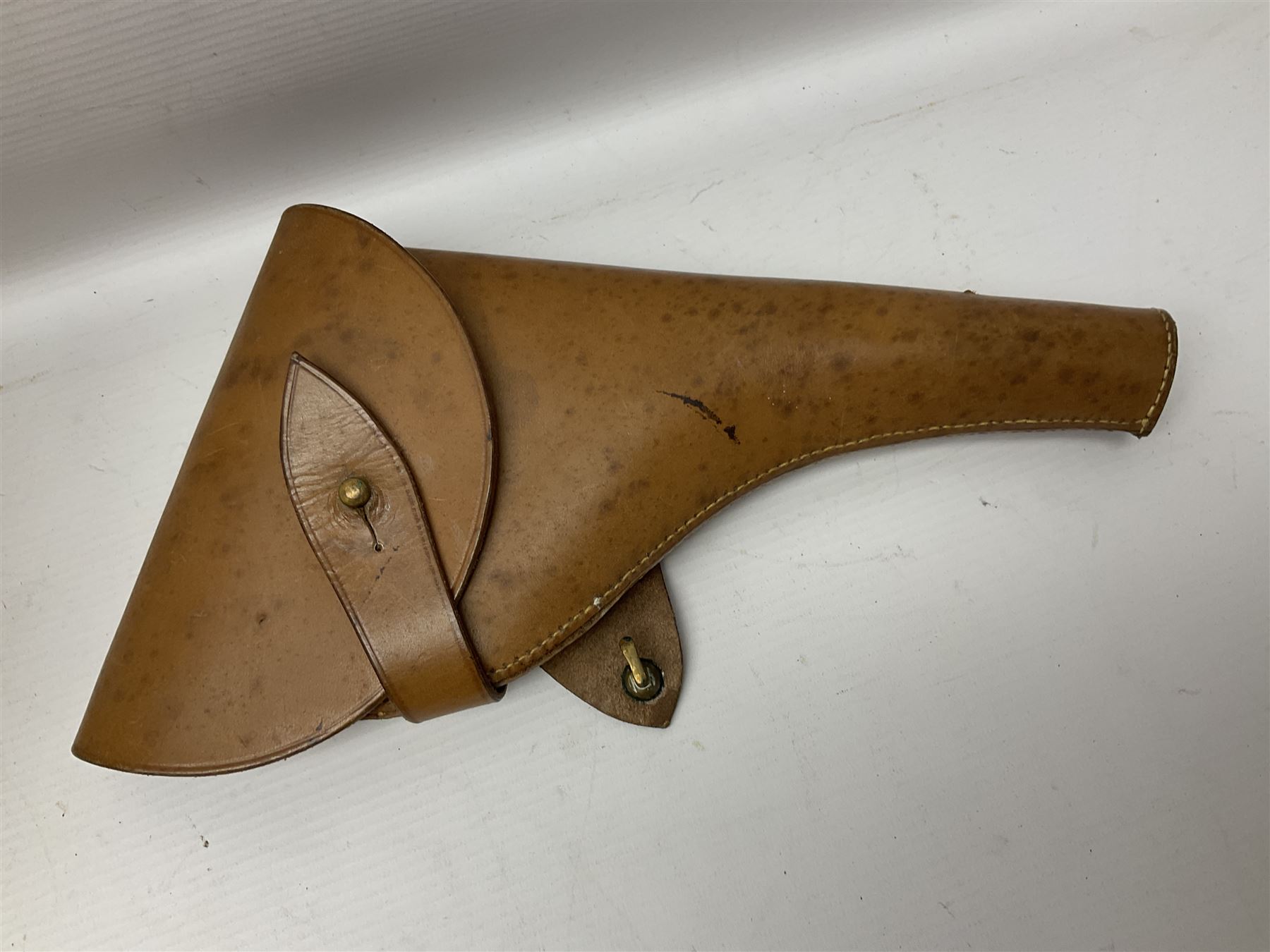 British Army General Staff officer's peaked cap by Herbert Johnson London in Moss Bros. delivery box; two officer's Sam Browne leather belts; leather pistol holster and sword hanger; pair of leather gloves and pair of spurs