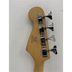  Fender Squier Bronco Affinity Series electric bass guitar, in black and white, serial no. IC021107489, L108cm, in associated Squier soft carrying case. From the collection of the late John Burgess of Beverley who played in the bands Penjants, Wine, Strollers, Revox, Sound Foundation, Pickle Belly Alley, Ragamuffins and Jerryattricks.