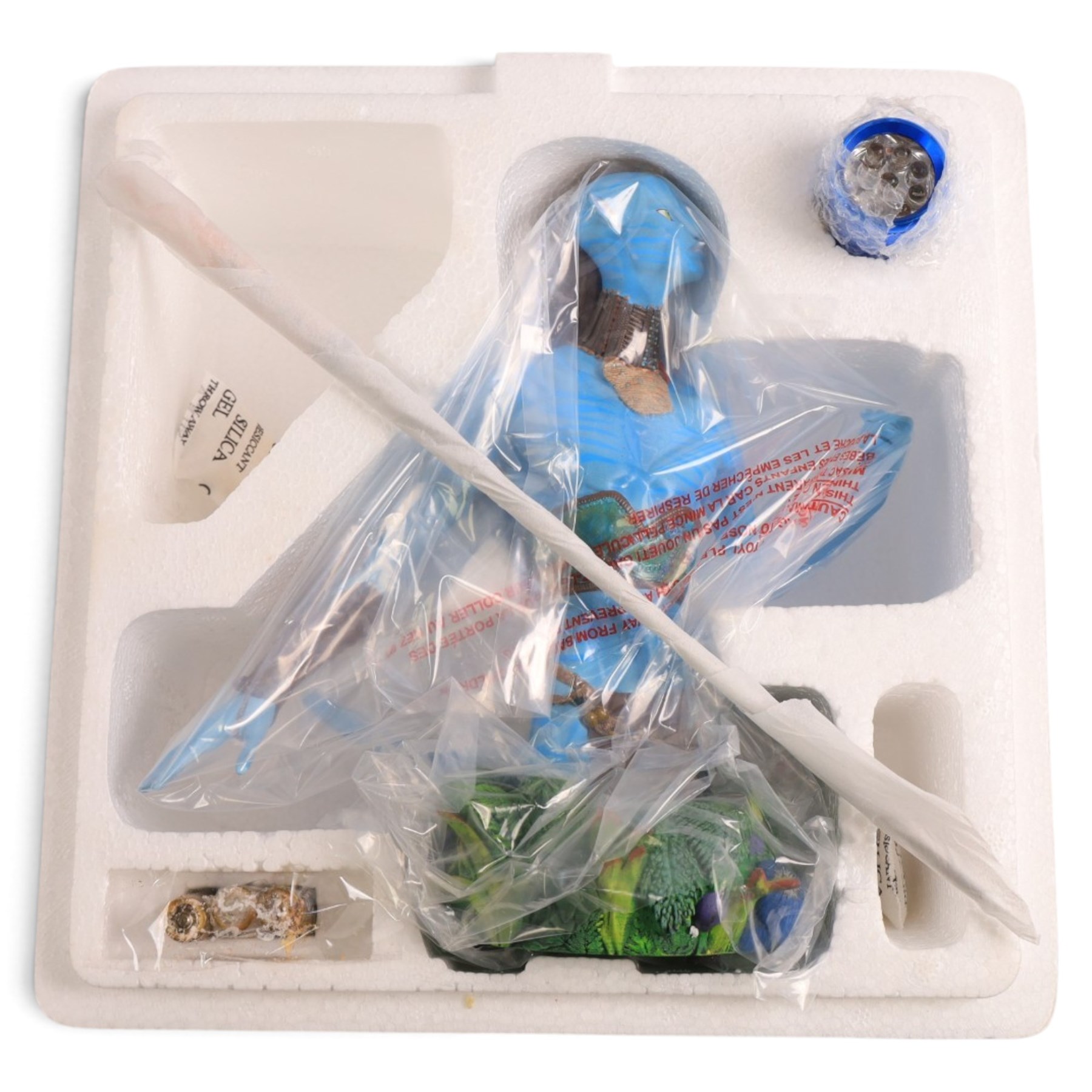 Two limited edition Gentle Giant Avatar 'Tsu'tey' Collectible Mini Busts, both boxed, together with an Avatar choker/bracelet and The Noble Collection Na'vi resin dagger replica on curved display stand