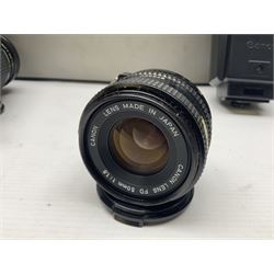 Canon A1 35mm camera body serial no 741264, with 'Tokina AT-X 28-85mm 1:3.5-4.5' lens serial no 821679, 'Canon FD 50mm 1:1.8mm' lens and other camera equipment 