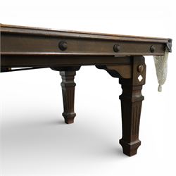 Riley - late 20th century Riley slate bed snooker table with dining table leaves, rectangular baize playing surface within a moulded hardwood frame with studded frieze rails and leather pocket mounts with net bags, raised on four square tapering fluted supports with block feet, with associated dining table leaves, with various cues, chalks, snooker and eight ball pools