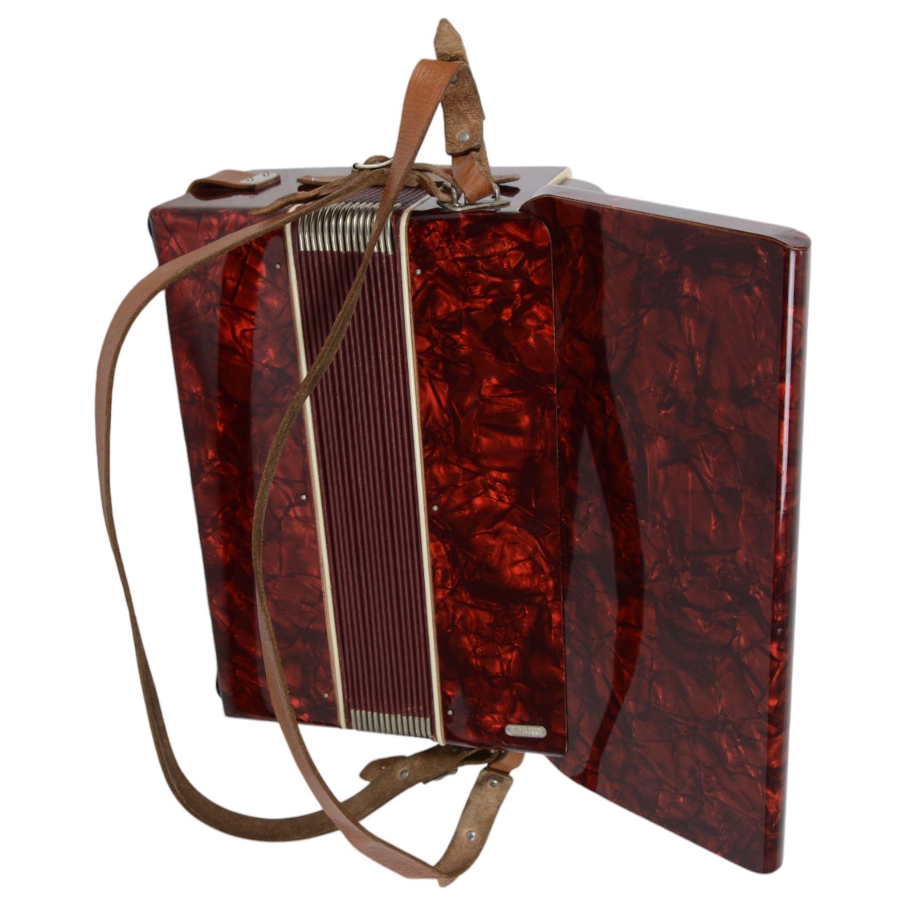 World master piano accordion with  14 fold bellows, two octave keyboard and 32 buttons. With a hard carrying case.