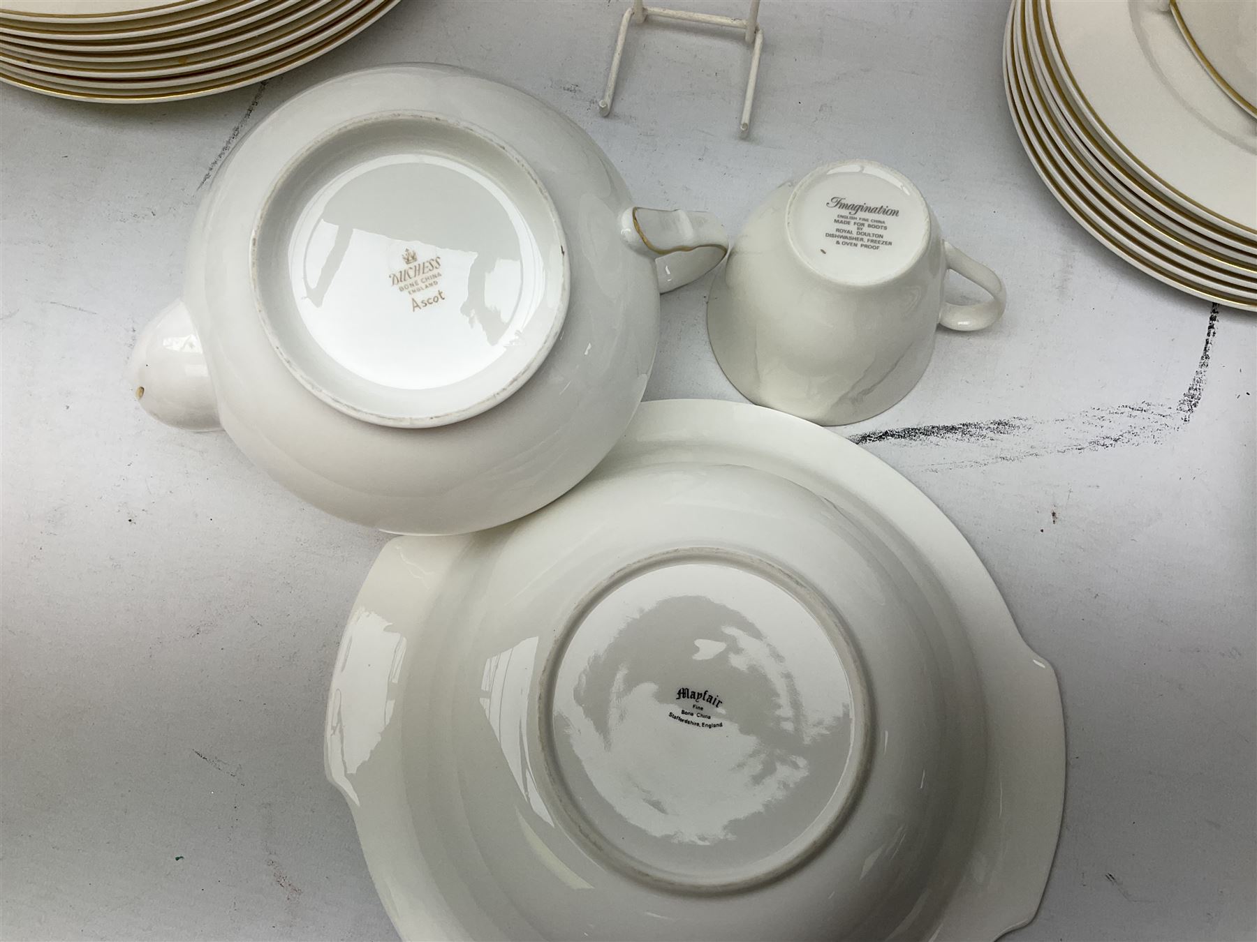 Royal Doulton Imagination pattern part dinner service, comprising eight dinner plates, eight side plates, eight dessert plates, eight bowls and nine cups and saucers, together with Royal Doulton Fortune pattern, five covered tureens,  jug and stand and other similar