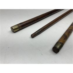 Three early 20th century walking sticks, to include a smoking pipe walking stick, the cane opening to reveal a concealed pipe, and a wooden walking cane, the metal cover with inscription 'bell metal and wood of York Minster, Burnt May 20 1840, and a turned wooden walking stick, with marquetry checkerboard pommel, tallest L90cm