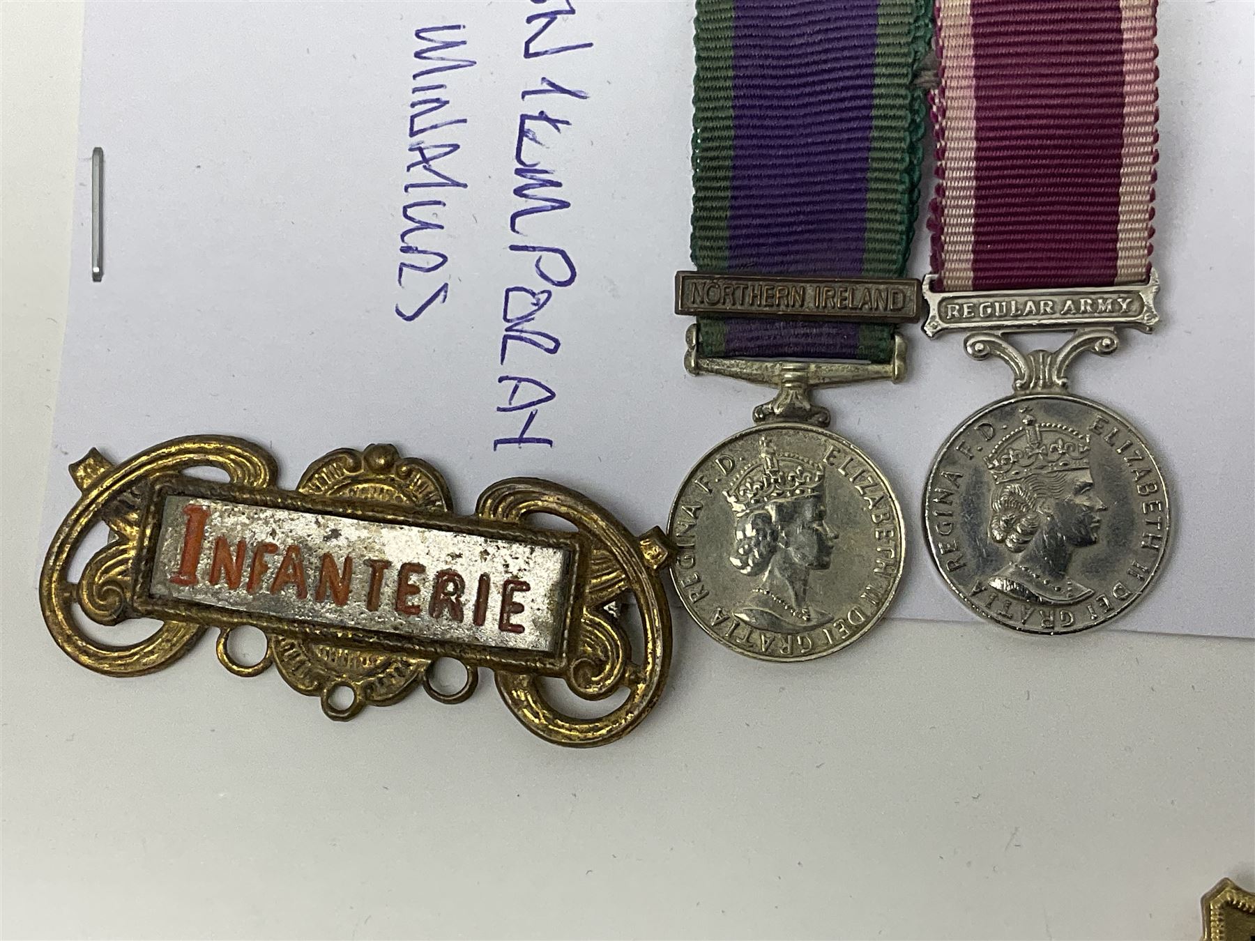 Eleven medal miniatures including Turkish Crimea, OBE (Civil), WW2 Burma Star and France/Germany Star, two pairs of WW2 War/Defence medals, LSGC etc; and two military badges