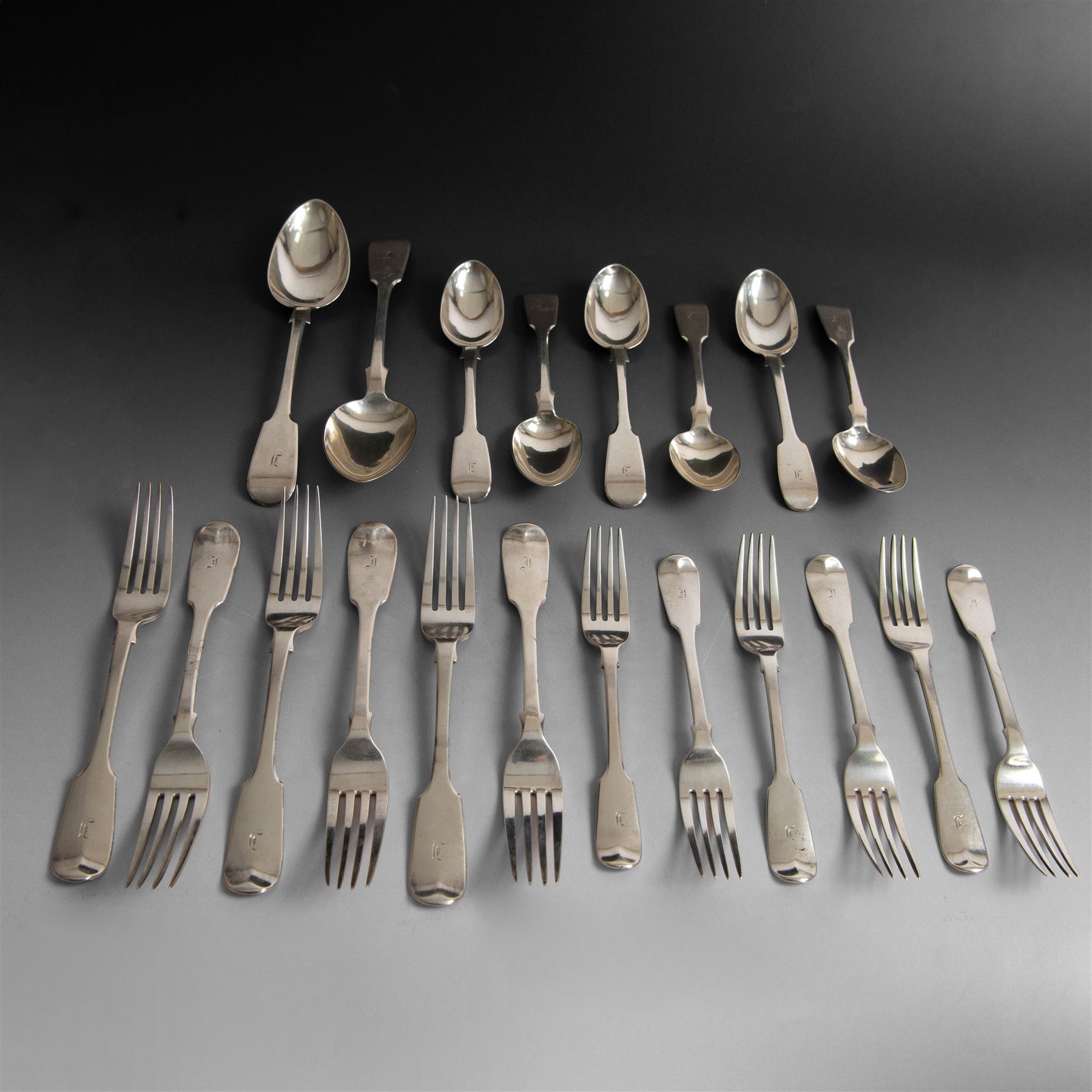 Set of Victorian silver Fiddle pattern cutlery for six place settings, comprising two table spoons, six dessert spoons, six table forks and six dessert forks, all engraved with initial to terminal, table spoons and dessert spoons hallmarked Robert Williams & Sons, Exeter 1848, forks hallmarked Henry Holland, London 1847