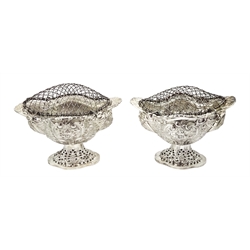 Four Victorian silver pedestal bon bon dishes, embossed foliate and pierced decoration, with glass liners by Charles Stuart Harris, London 1892, height 13cm