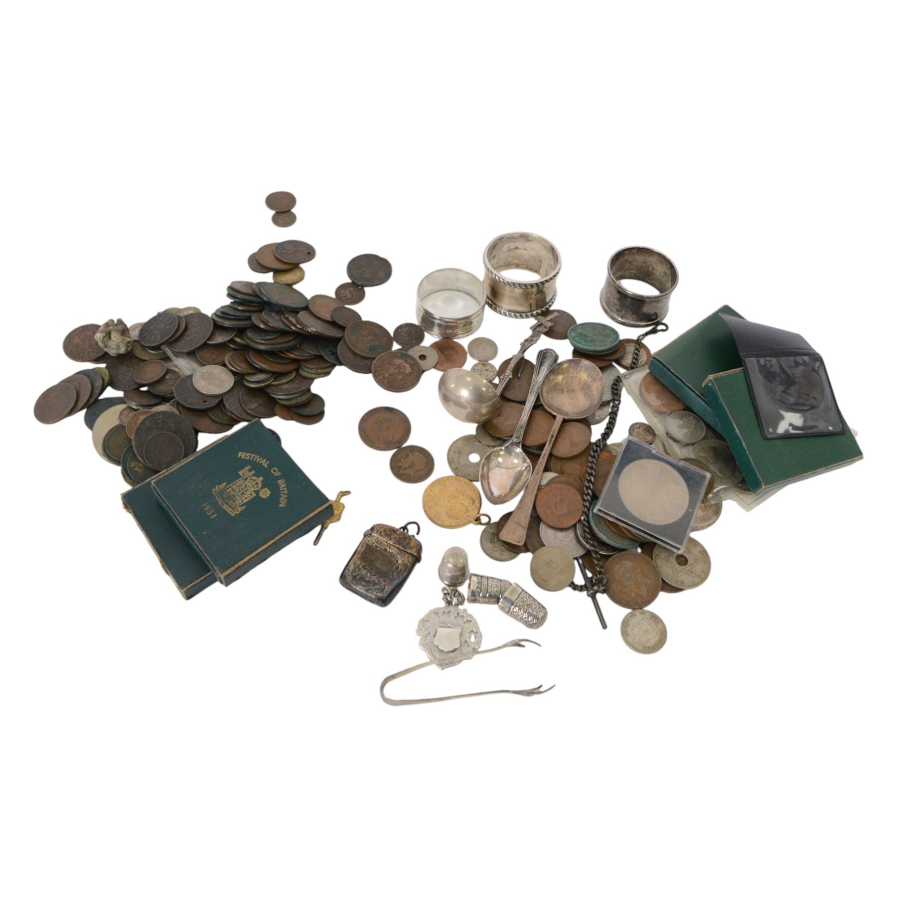 Group of silver, including three napkin rings, three spoons, sugar tongs, three thimbles, vesta case, chain and fob, together with a collection of coins