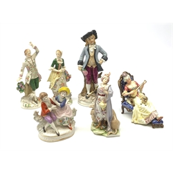 A pair of Sitzendorf figures, modelled as a male and female figure in eighteenth century dress with sheep beside feet, each upon gilt detailed circular base, each with printed mark beneath, tallest H18.5cm, together with a Volkstedt figure modelled as a Eastern female figure with camel seated at her feet, with printed mark beneath, a Sitzendorf figure of a young male figure, a figure modelled as a seated female playing the lute, with dog seated upon her lap, and a figure group marked foreign. (6). 