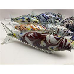 Collection of mid 20th century murano style glass fish, each with multi coloured inclusions largest L42cm