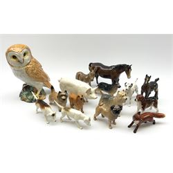 A group of Beswick figures, comprising Barn Owl 1046, various small dog figures including Yorkshire Terrier, Cairn Terrier, Dalmatian, Beagles, Pug, etc., CH Wall Champion Boy 53 pig, fox, donkey, horse, and foal. 