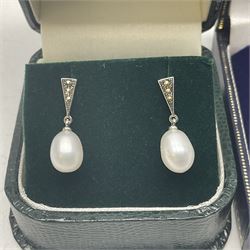 Two pairs of silver marcasite and pearl earrings, both stamped 925 and boxed 