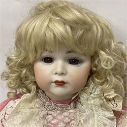 Reproduction Simon & Halbig bisque head doll with applied hair and jointed limbs; marked Simon & Halbig 117, H58cm