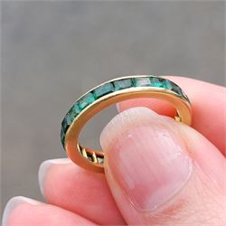 18ct gold emerald full eternity ring, channel set with calibre cut emeralds