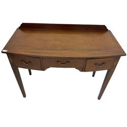 Edwardian mahogany dressing side table, raised back on bow front top with satinwood band, fitted with three drawers, inlaid with shell and fan motifs, square tapering supports