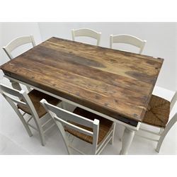 Mexican painted and polished pine rectangular dining table, raised on turned supports (W150cm, D90cm, H76cm), together with six chairs, rush seat raised on square supports (W40cm)