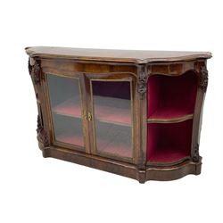 19th century rosewood buffet credenza, bombe form with shaped and moulded top, two central glazed doors with foliate moulded gilt slips, the red fabric-lined interior fitted with a single shelf, flanked by open shelves with raised gilt metal lips, the uprights decorated with shell and flower head carved cartouche mounts, acanthus leaf scroll carved lower mounts, on shaped and moulded plinth base 
