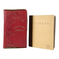 Collection of postcards in a album, together with an album of first day covers 
