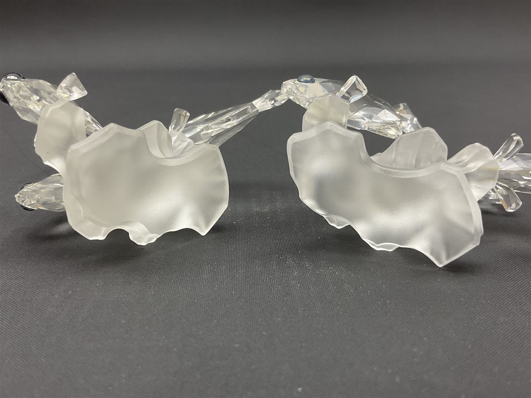 Swarovski Crystal sea creatures, comprising lion fish and dolphin, both with coloured elements, together with two seahorses, two small fish groups, butterfly fish, longnose butterfly fish and six coloured shells, tallest H8.5cm