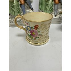 Victorian mug decorated with painted blossoming sprays and gilding, bearing poem, together with a mid 19th century jug with applied periwinkle blue decoration on white ground, and two Staffordshire style figure groups depicting a seated gentleman and woman with baskets