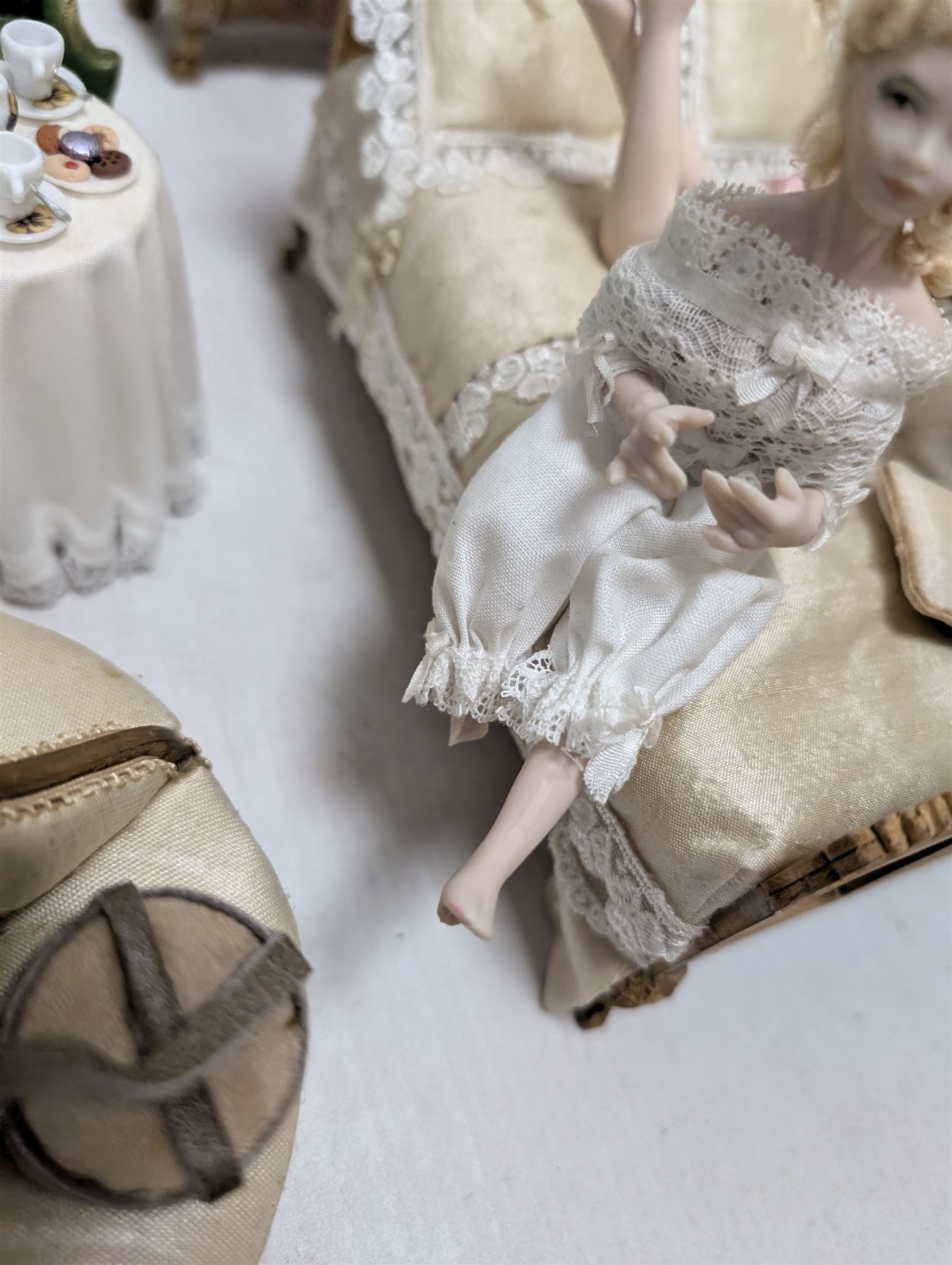 Dolls house bathroom and bedroom furniture, including bed, wardrobe, dresser filled with toiletries, shower, five figures, etc 