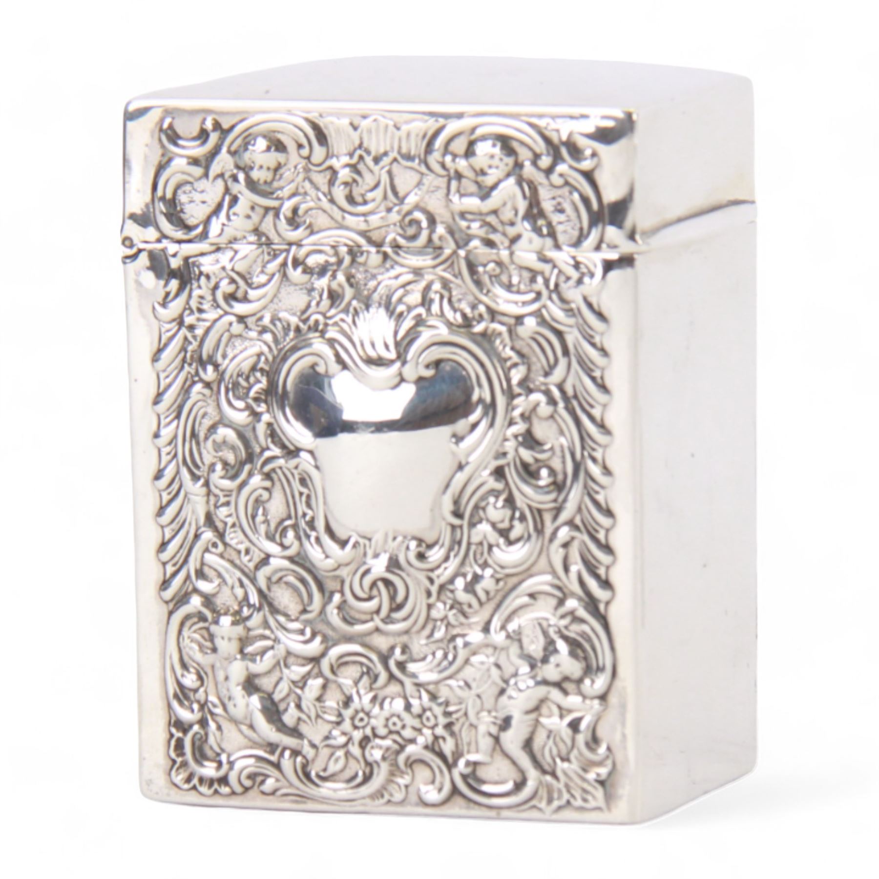 Late Victorian silver playing card box, of rectangular form with hinged top, the front and back embossed with vacant cartouche, surrounded by putti, foliate scrolls and C scrolls, hallmarked William Comyns & Sons, London 1900, H7.5cm W5.5cm D3.5cm