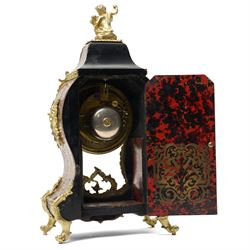 Rollin à Paris - 19th century French Louis XV style ormolu-mounted red tortoiseshell and brass Boulle-work mantel clock, surmounted by a seated musical putto above a waisted case applied with mask, rocaille, foliate and dolphin mounts, the gilt dial with white enamel Roman numeral cartouches, twin-train movement striking on a bell, signed and numbered 480, on four scrolling foliate feet