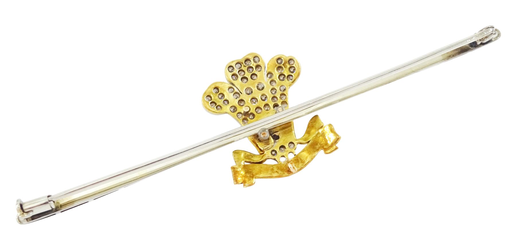 Early 20th century gold and palladium 3rd Dragoon Guards, multi gemstone set brooch, the Prince of Wales crest set with old cut and rose cut diamond ostrich feathers, garnet and ruby coronet and enamelled logo, in silk and velvet lined case by Harrods of London 