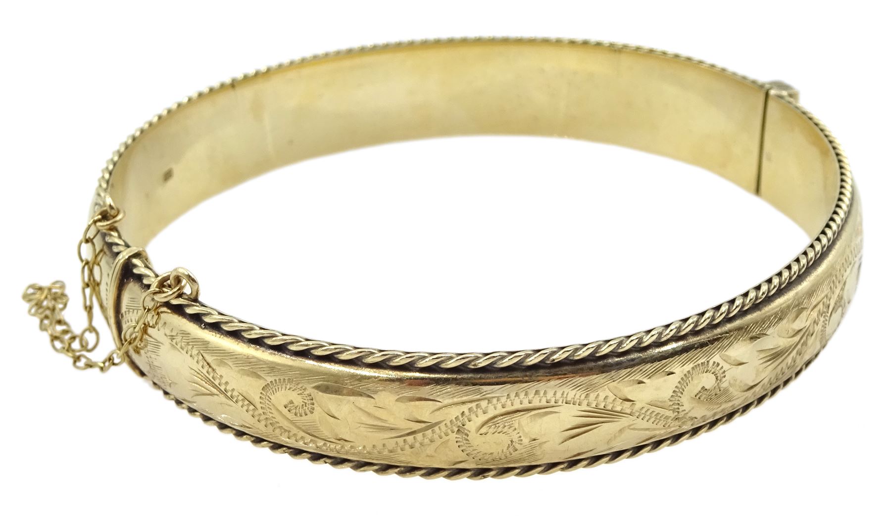 9ct gold hinged bangle with engraved and rope twist decoration, hallmarked 