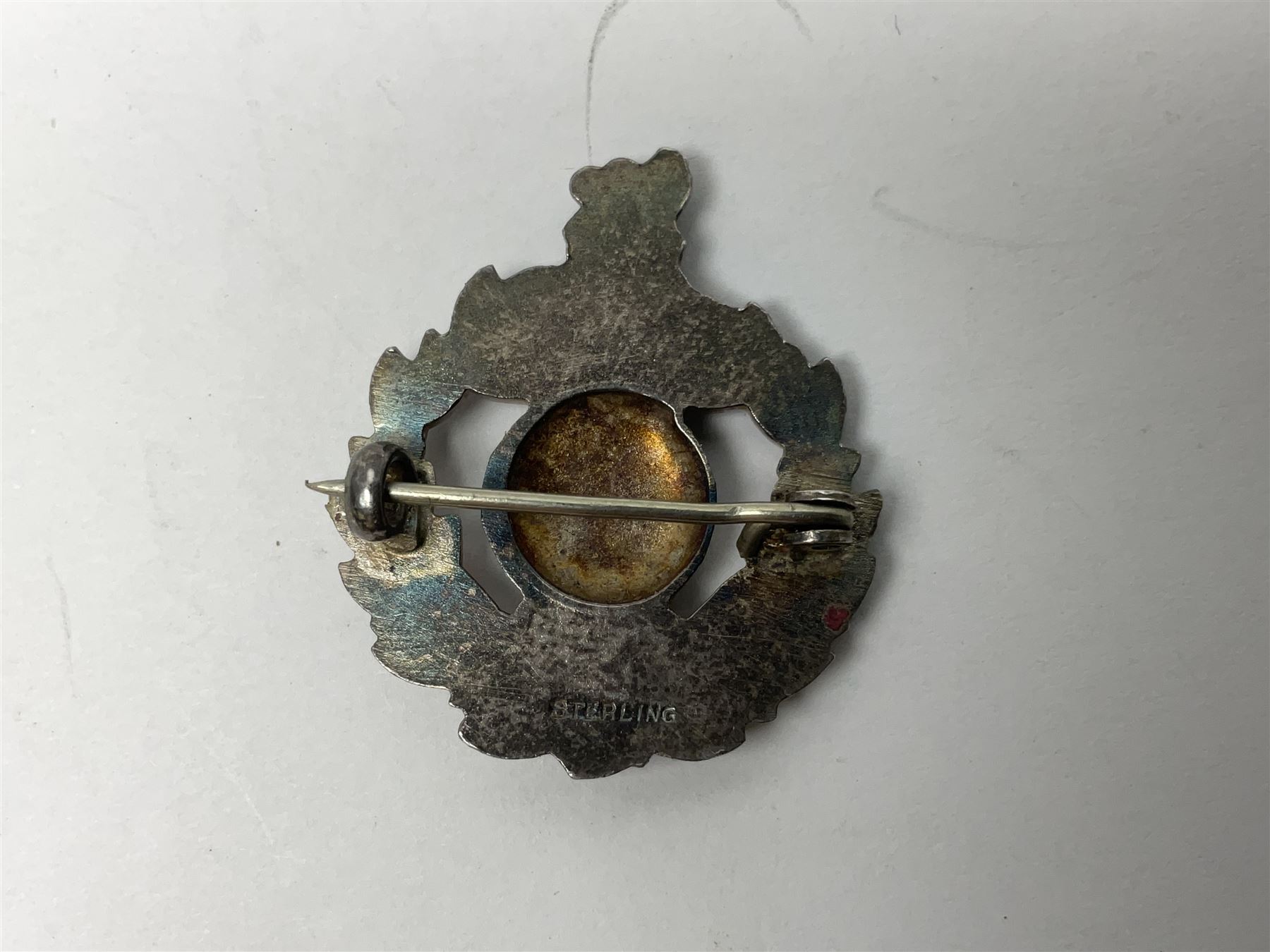 Five silver sweetheart brooches - Royal Artillery with marcasite, Naval with marcasite, George VI Royal Engineers with tortoiseshell, Royal Marines Gibraltar with enamel and South African General Service with blue enamel (5)