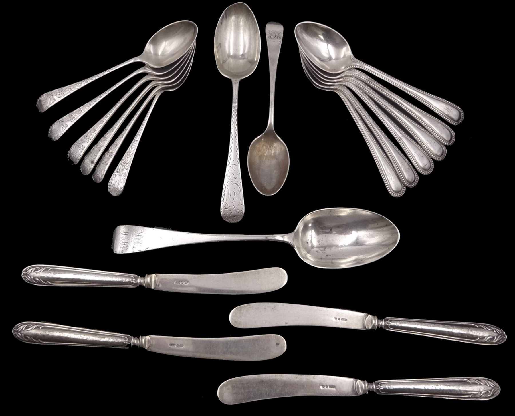 Group of silver flatware, comprising set of six early 20th century teaspoons with foliate engraved detail, hallmarked Joseph Rodgers & Sons, Sheffield 1909 and 1911, a set of six Victorian beaded edge teaspoons, hallmarked Sheffield 1897, Victorian dessert spoon, hallmarked Charles Boyton (II), London 1886, late Victorian teaspoon, and four early 20th century silver handled butter knives, approximate weighable silver 10.27 ozt (319.5 grams)