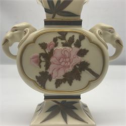 19th century Royal Worcester aesthetic movement vase in blush ivory, the rectangular neck above twin pierced elephant mask handles with opposing panels decorated with a bird and floral spray raised on a spreading rectangular foot, with puce mark beneath 