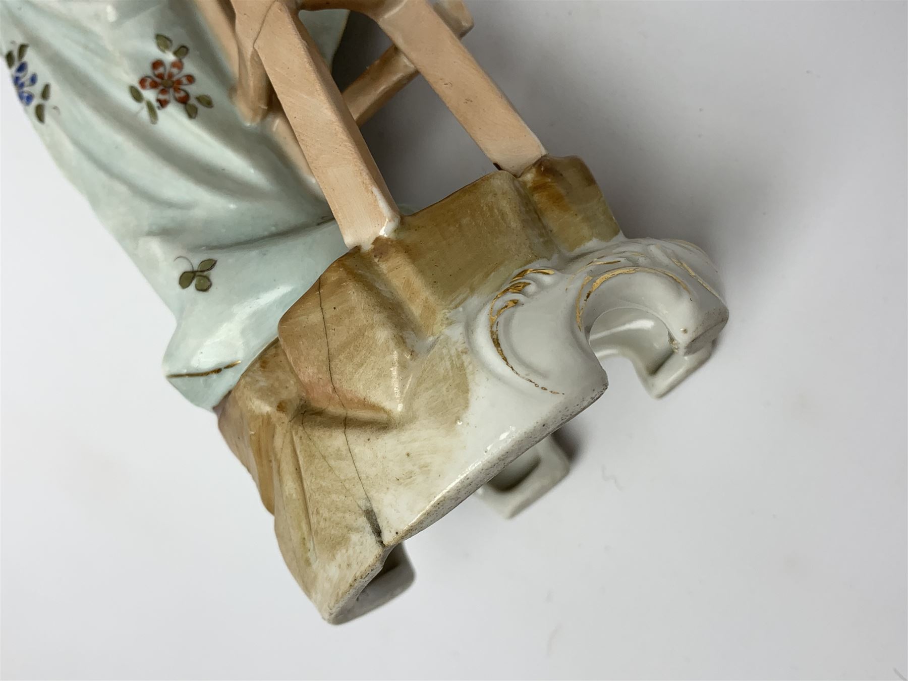 A group of five Continental figurines modelled as the arts, emblematic of music, painting, sculpture, literature, and theatre, each with spurious blue cross mark beneath, H22.5cm. (5). 