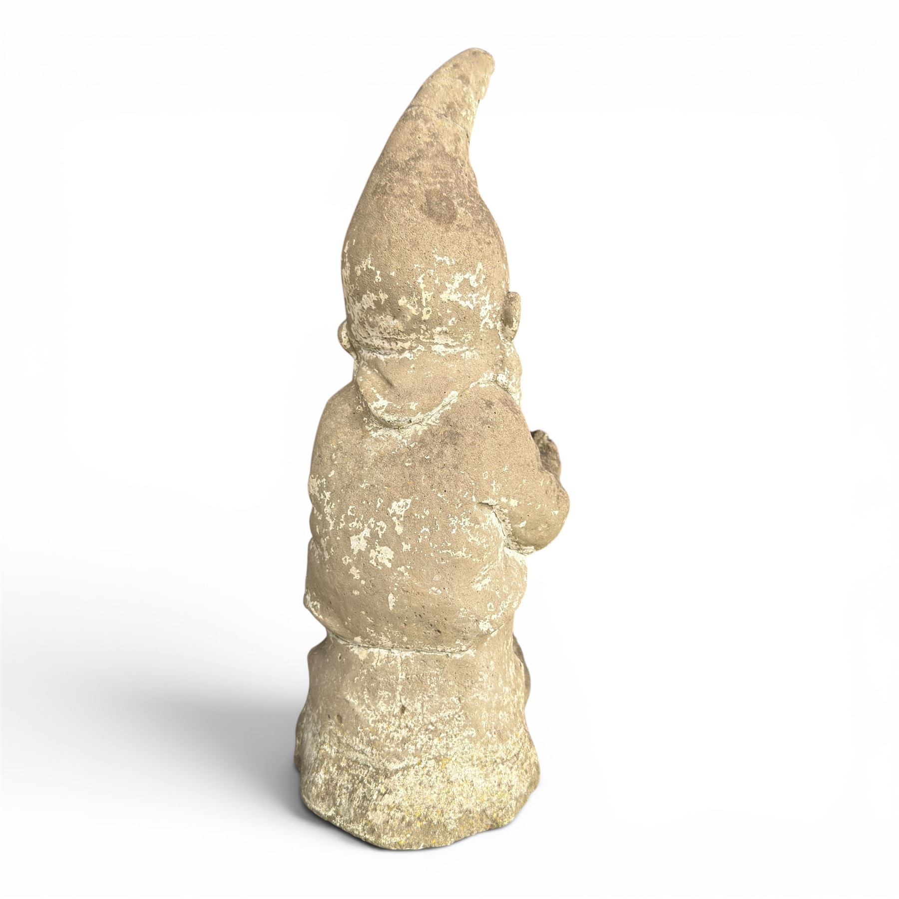 Two seated cast stone garden gnomes