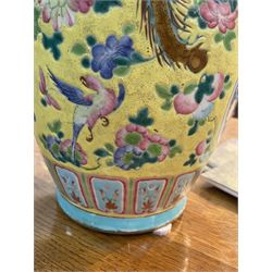 19th century Chinese famille rose yellow ground porcelain vase, of baluster form with twin applied mask ring handles, the body decorated with two shaped reserves mounted with dragon heads, depicting warriors at battle and at court, the neck with two smaller conforming figural reserves, upon a yellow ground decorated with exotic birds amidst scrolling blossom, H45.cm