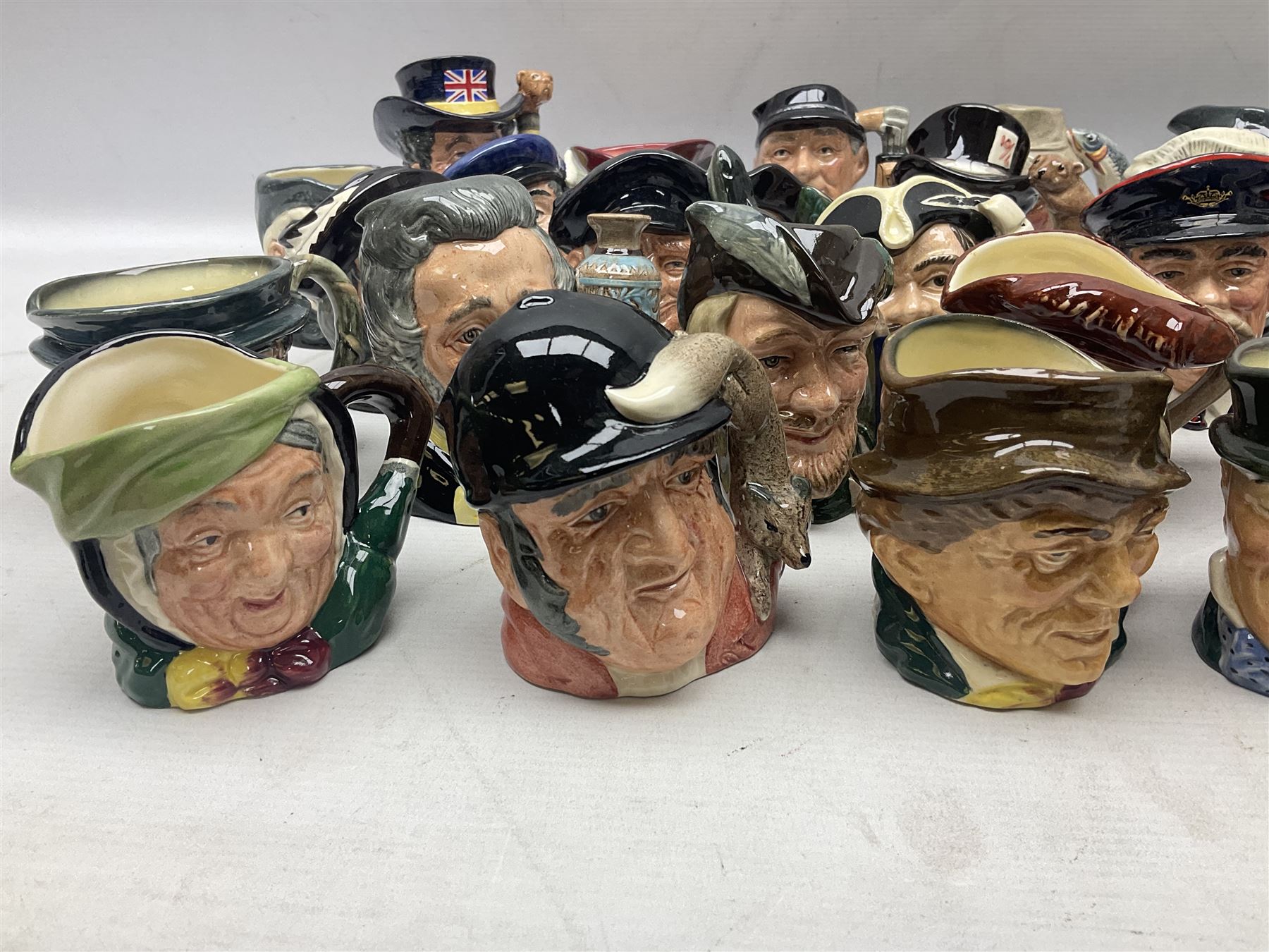 Large collection of Royal Doulton miniature character jugs, to include The Postman D6801, The London 'Bobby' D6762, Old Salt, D6554, Sir Henry Doulton D6703 etc  