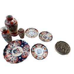 Four Imari chargers, together with three vases, largest vase H31cm