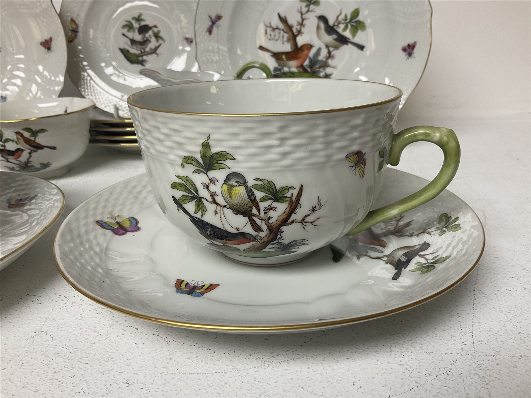 Herend of Hungary Rothschild bird pattern, part tea service, comprising two large teacups and saucers, two teacups and three saucers, milk jug, sugar bowl, five dessert plates and two side plates (18)